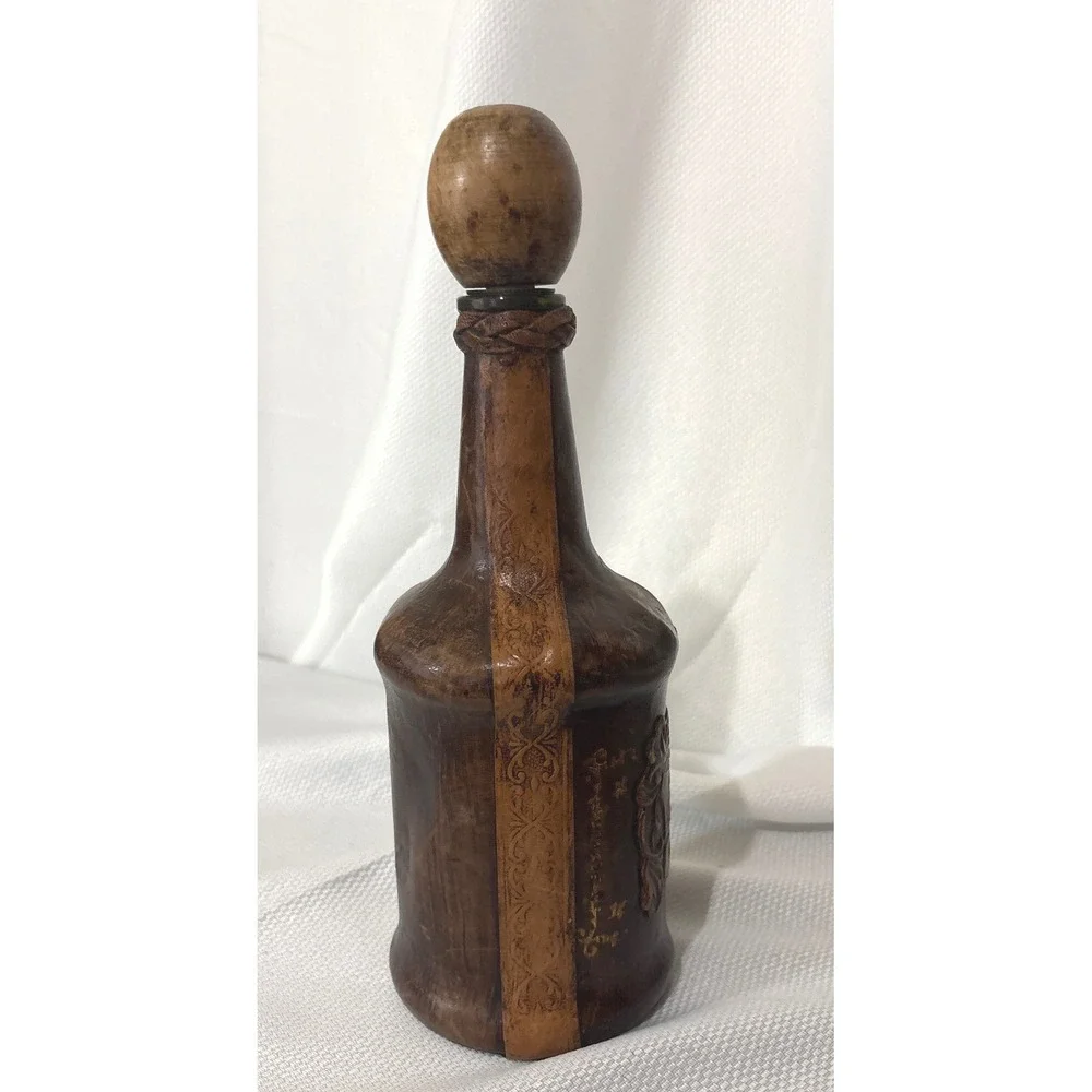 Vintage Leather Wrapped Decanter Bottle Embossed Coat of Arms Crest Wood Stopper